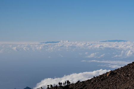 Viewpoint on the top of the mountain with blue sky, clouds and mountains at the background