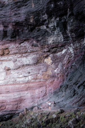 Woman in nature with heavy mountain in backgroundの写真素材