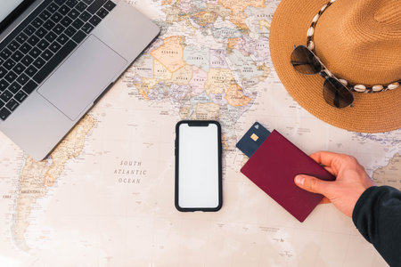Unrecognizable person catching passport credit card, smartphone white screen