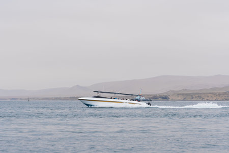 Tour operator yatch on the Pacific ocean in Paracas, isla Ballestas, Peruの写真素材