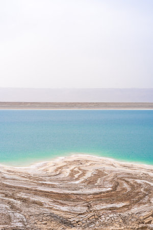 Desert landscape of Dead Sea coastline with white salt in Jordanの写真素材