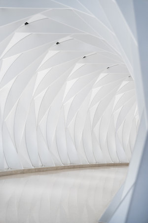 Modern white futuristic tunnel creating an abstract vanishing pointの写真素材
