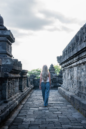 Tourist walking in plaosan lor temple, ancient buddhist ruins in indonesiaの写真素材