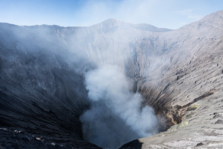 Smoke rising from mount bromo crater in indonesiaの写真素材