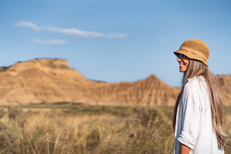 Tourist smiling and enjoying the bardenas reales desert landscape in spainの写真素材