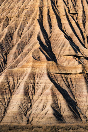 Eroded ridges creating stunning natural patterns in desert landscape in Bardenas Realesの写真素材