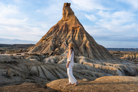 Tourist enjoying castildetierra peak in bardenas reales natural park at sunsetの写真素材
