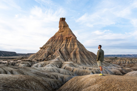 Rear view of tourist exploring unique landscape of bardenas reales natural park in navarre, spainの写真素材