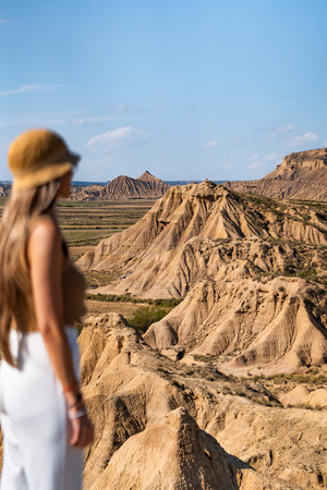 Tourist admiring the bardenas reales desert landscape in spainの写真素材