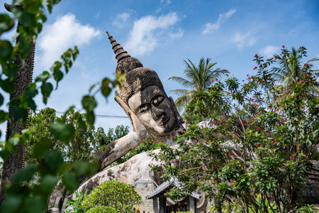 Reclining buddha statue at buddha park in vientiane laosの写真素材