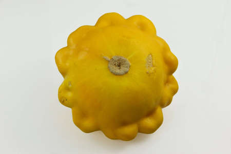yellow pattypan squash on white backgroundの写真素材