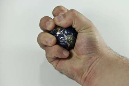 hand holding a globe