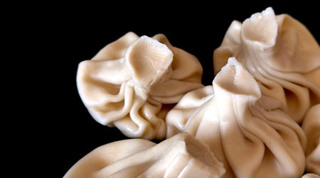 Georgian dumplings khinkali on a black background.の写真素材