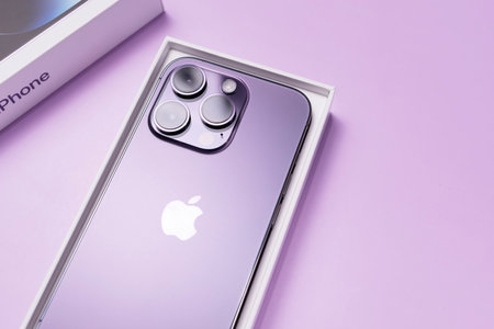 Deep Purple colored iPhone 14 Pro with features Always-on display, 48-megapixel Main camera, Dynamic Island. Purple background. Vertical plane.Copy space Bialystok, Poland: January 20,2023のeditorial素材