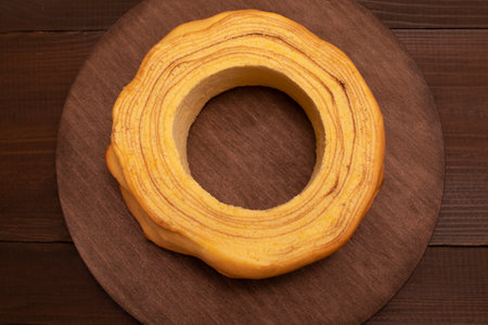 Top view of baumkuchen, sakotis ,sekacz on wooden table, traditional spit cake of lithuanian,...