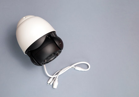 IP Smart Outdoor Security Camera On Gray Background. Smart Home, House Surveillance, System With...