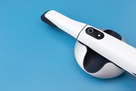 White 3d Intraoral Dental Tooth Scanner On Blue Background. Dental Equipment, Device For Scanning...
