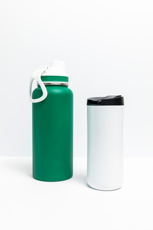 Isolated Reusable Sport Green and Water Bottles, Protein Shaker On White Background. Tumbler, Product Template. Travel Hiking Mug Vertical Plane.の写真素材