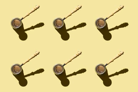 Turkish Coffee pot on yellow background. patternの写真素材