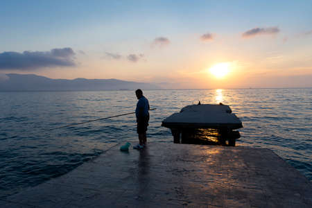 Sunset over the sea. Pier on the foreground.の写真素材