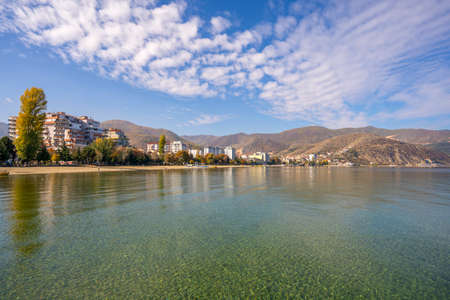 Amazing view on the green tree, mountains, sea with turquoise water and colorful blue sky at...