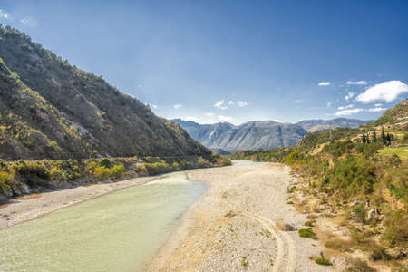 Beautiful mountain valley with gentle hills and riverの写真素材