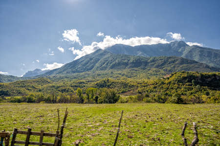 plowed field against the background of mountains in Albania. Agricultural landscapeの写真素材