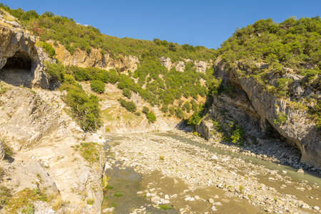 Holiday goers relax and go swimming in the thermal baths in Benje.の写真素材