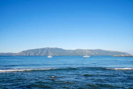 Wooden vessel on the shore of Vlora port. Stunning spring seascape of Adriatic sea. Nice morning scene of Albania, Euroepe. Traveling concept background.の写真素材