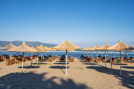 Beach umbrellas from the sun and sun loungers on the beach.の写真素材