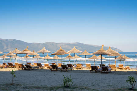 Beach umbrellas from the sun and sun loungers on the beach.の写真素材