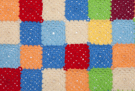 Multicolored plaid squares of crochetedの写真素材