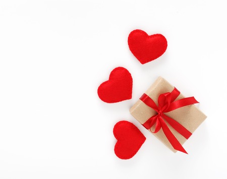 Valentine's day card with gift are red hearts isolated on white background with copyspaceの写真素材