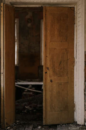 old open door in one of the houses of the city of Chernobylの写真素材