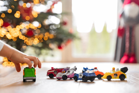 There are cars lined up on the floor. Christmas gift for a boy, game without a faceの写真素材