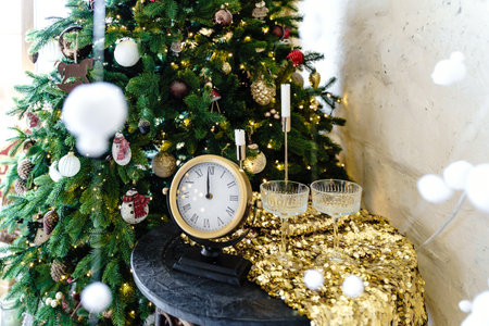 New Year banner with a coffee table near a Christmas tree with a round clock and glasses
