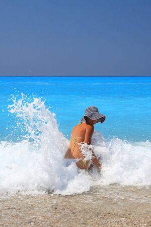 Pretty blonde woman enjoying the Ionian sea in Greeceの写真素材