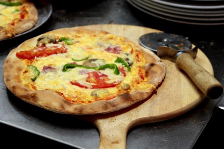 Hot fresh deluxe pizza. Right out of the oven and ready to eatの写真素材