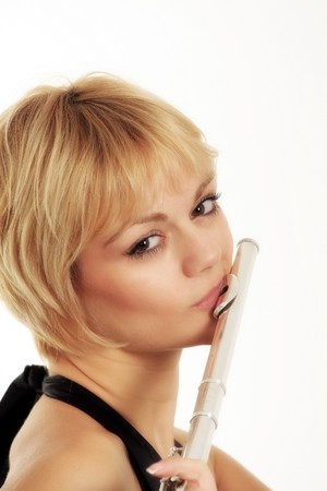 Portait of a flautist isolated on white backgroundの写真素材