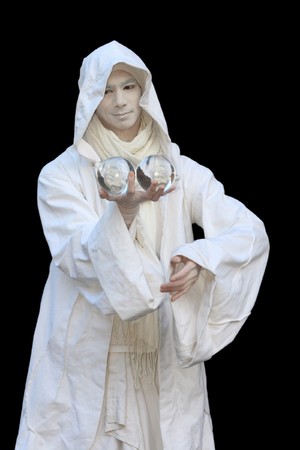 White Wizard manipulating Crystal balls isolated on black background.の写真素材