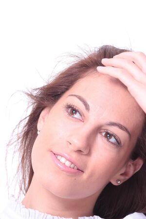 Closeup portrait of a happy young woman smiling isolated on white backgroundの写真素材