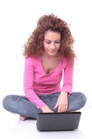 Closeup portrait of a young woman using laptopの写真素材