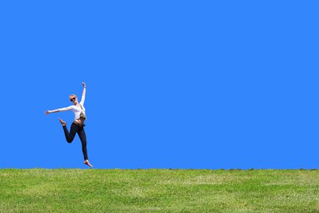 pretty young woman is jumpingの写真素材