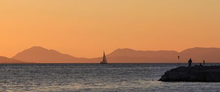 Harbor of of Sivota Greece at sunsetの写真素材