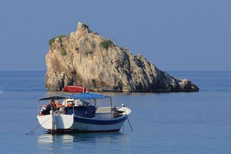 Fishing boat in the ionian sea in Greeceの写真素材