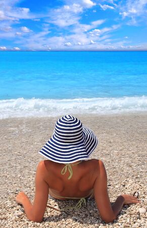 Beautiful young woman enjoying the Ionian sea in Greeceの写真素材