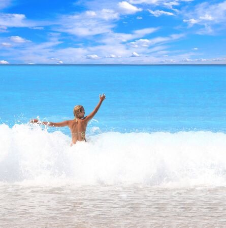 Beautiful young woman enjoying the Ionian sea in Greeceの写真素材