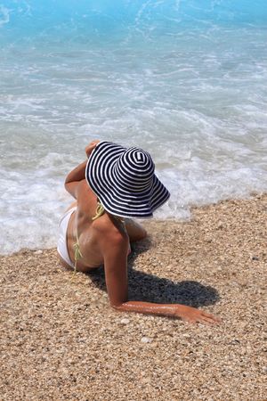 Young beautiful sexy tanned blond woman in bikini in the seaの写真素材