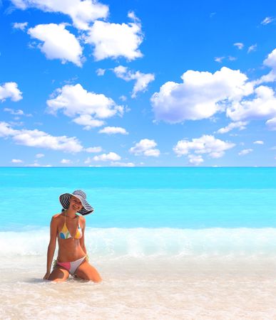 Young beautiful sexy tanned blond woman in bikini in the seaの写真素材