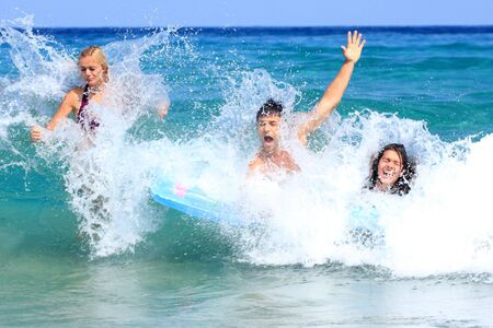 Portrait of joyful group of people having fun in the sea and laughing
の写真素材